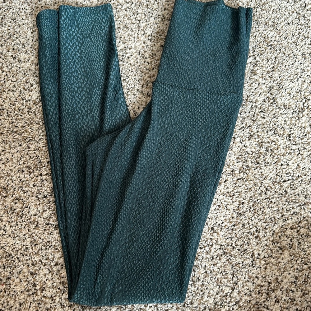 Green snake skin leggings.